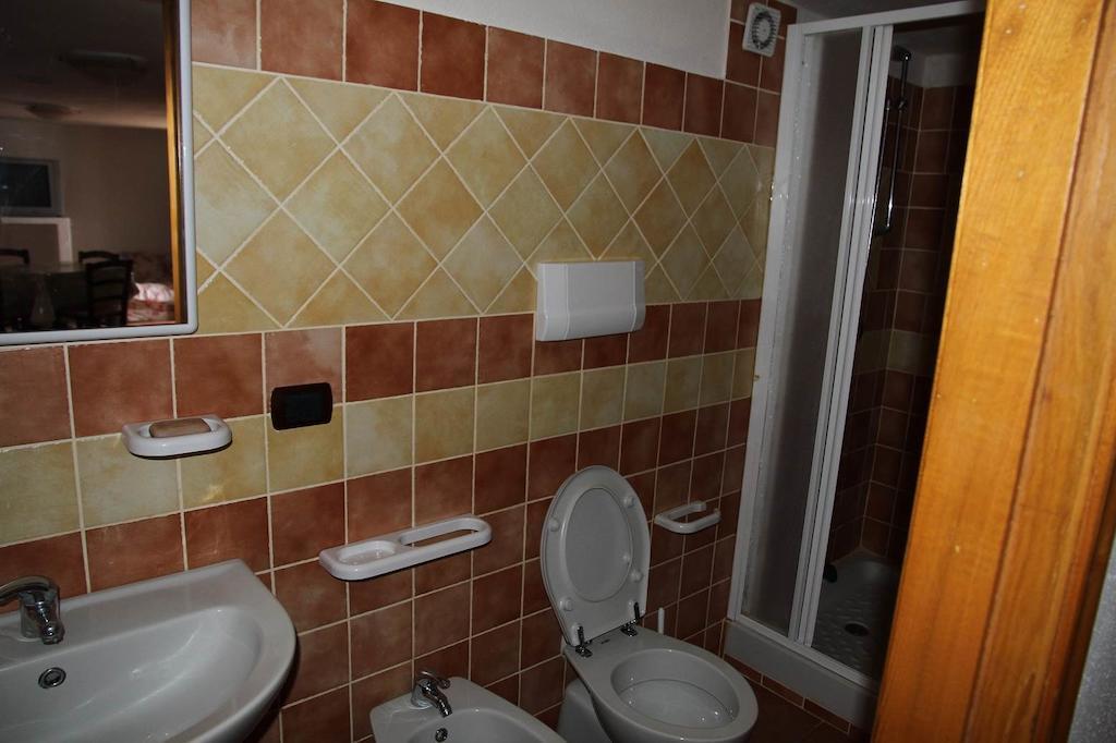 Addisora Appartamenti Cala Liberotto Quarto foto
